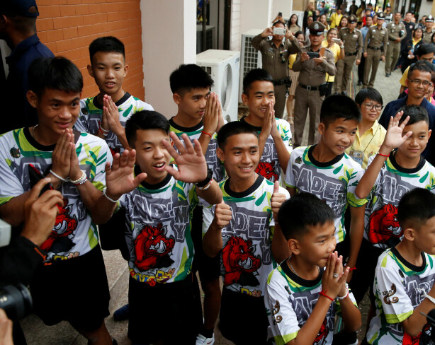 The 12 boys and their soccer coach who were rescued from a flooded cave arrive for a news conference in the northern province of Chiang Rai, Thailand, July 18, 2018. REUTERS/Soe Zeya Tun